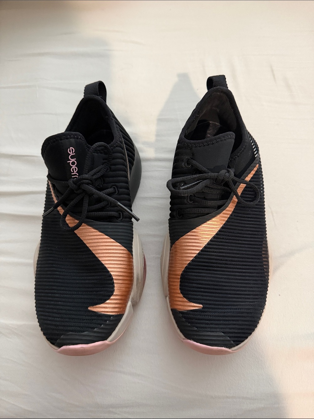 Nike Women's Black and Rose Gold Athletic Slip-On Sneakers